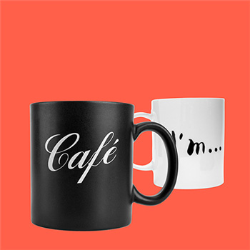 Two white mugs with screen printed text and line art designd, on a salmon pink background
